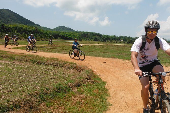 Koh Yao Noi Full Day Tour with Bike Ride & Lunch - Picnic lunch on a quiet beach: food, swimming, and weather reality