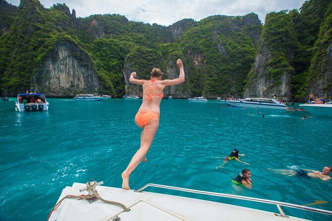 Phi Phi Island Hopping Day Trip by Speed Boat from Phuket - Loh Samah Bay: Jump In for Coral and Fish