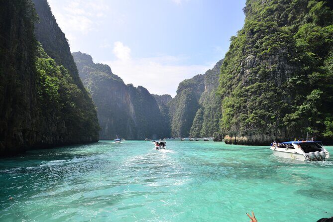 Phi Phi, Maya Bay, & Khai Islands Premium Trip from Phuket - Stop 4: Phi Phi Don island—snorkel options and a real base beach vibe
